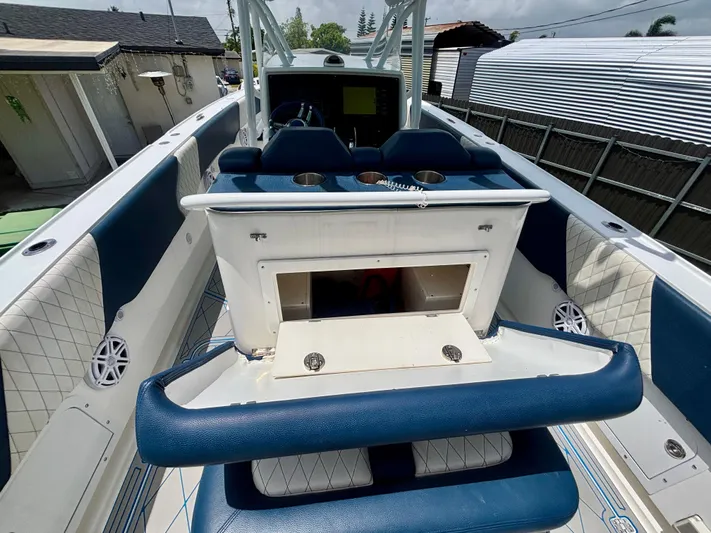  Yacht Photos Pics 2007 Midnight Express 39 Cuddy boat interior with blue seating and storage compartment.