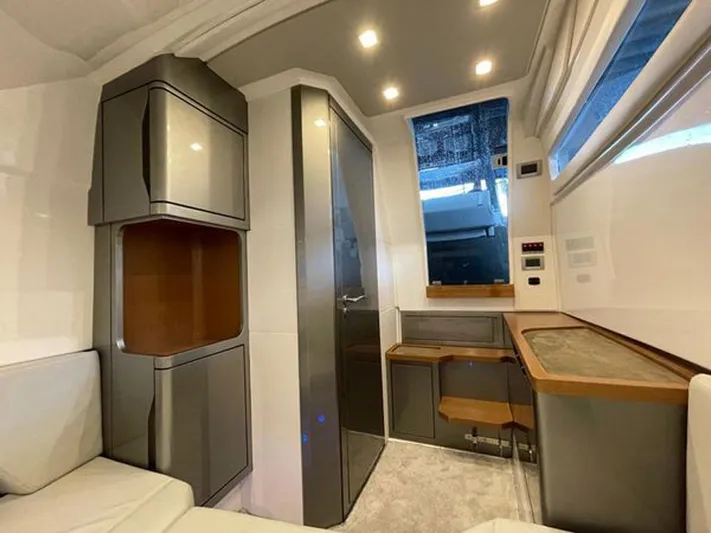 Trouble Maker Yacht Photos Pics Interior of 2022 Schaefer V33 yacht, featuring modern cabinetry and seating.