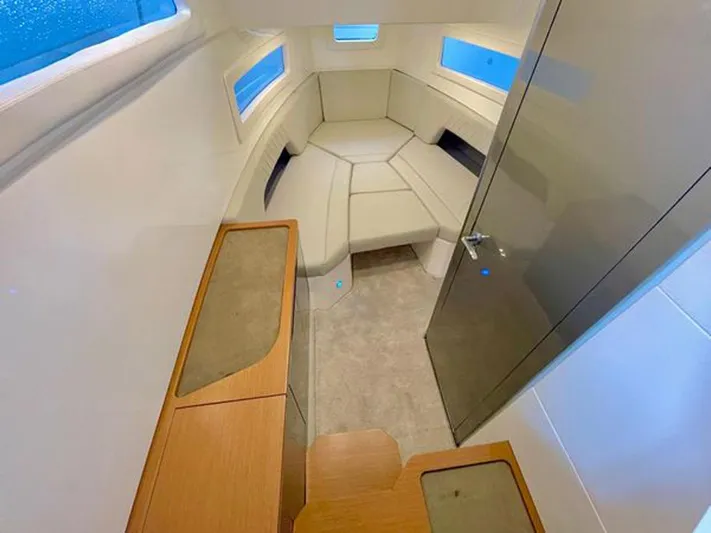 Trouble Maker Yacht Photos Pics Interior of 2022 Schaefer V33 yacht with modern seating and wooden accents.