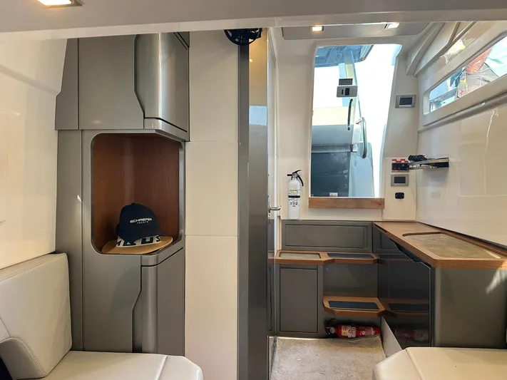Trouble Maker Yacht Photos Pics Interior of 2022 Schaefer V33 yacht, featuring modern cabinetry and seating.