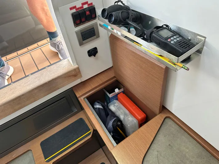 Trouble Maker Yacht Photos Pics Storage compartment and equipment on a 2022 Schaefer V33 boat interior.