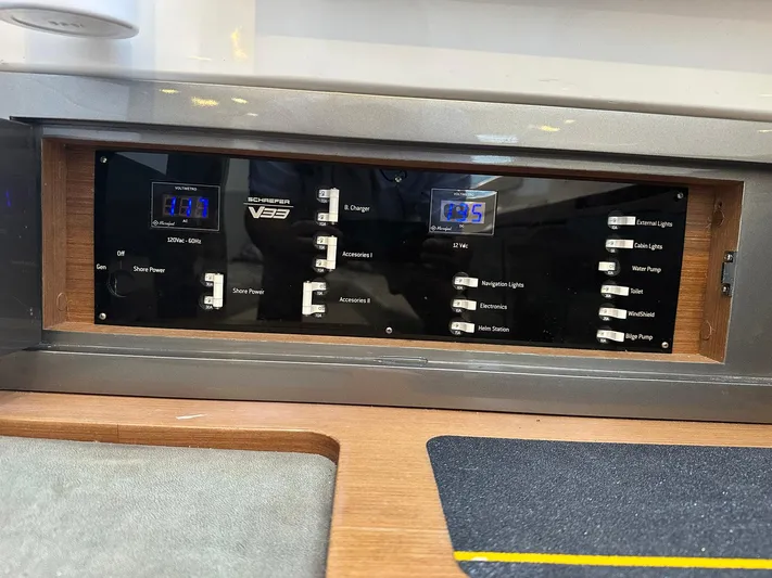 Trouble Maker Yacht Photos Pics Control panel of 2022 Schaefer V33 boat with switches and digital displays.