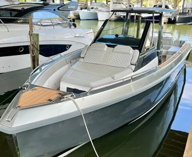 Trouble Maker Yacht Photos Pics 2022 Schaefer V33 boat docked in marina, sleek design with spacious seating.