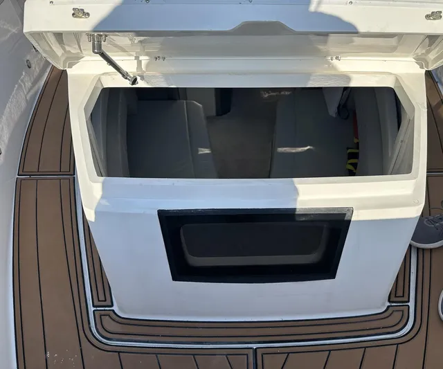 Trouble Maker Yacht Photos Pics Open storage compartment on 2022 Schaefer V33 boat deck.