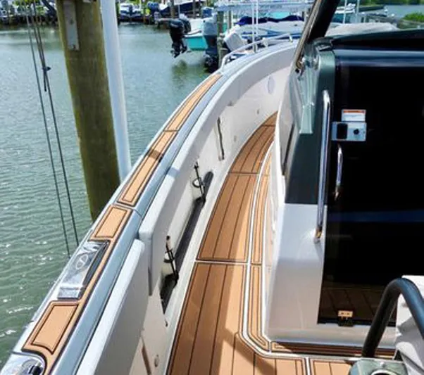 Trouble Maker Yacht Photos Pics 2022 Schaefer V33 boat deck with sleek design and wood finish.