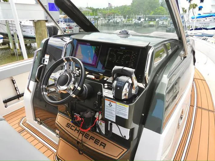 Trouble Maker Yacht Photos Pics Schaefer V33 2022 boat cockpit with modern navigation and control systems.