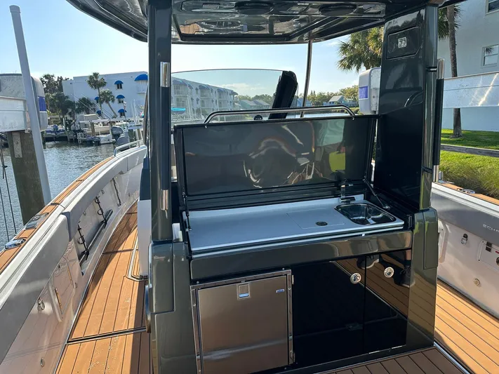 Trouble Maker Yacht Photos Pics 2022 Schaefer V33 yacht with sleek outdoor kitchen and modern amenities.