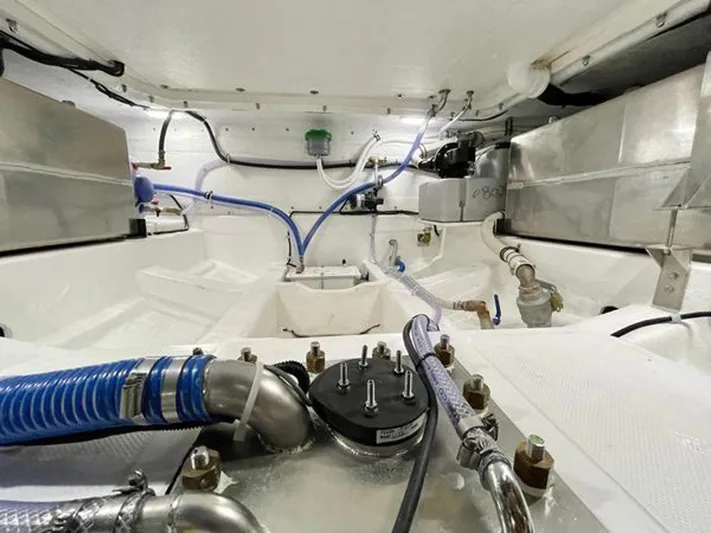 Trouble Maker Yacht Photos Pics Engine room of 2022 Schaefer V33 boat with visible pipes and fittings.