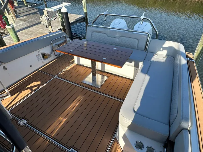 Trouble Maker Yacht Photos Pics 2022 Schaefer V33 boat with teak deck and cushioned seating area.