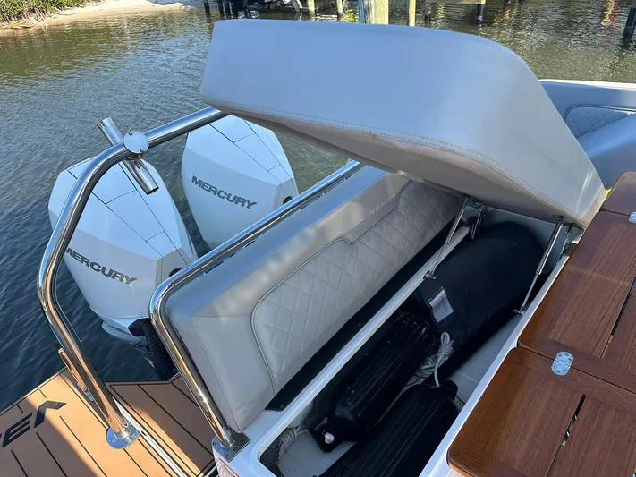 Trouble Maker Yacht Photos Pics 2022 Schaefer V33 boat with Mercury engines and open storage compartment.