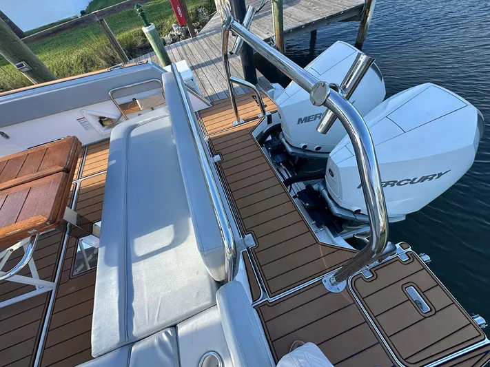 Trouble Maker Yacht Photos Pics Schaefer V33 2022 boat with twin Mercury outboard engines and teak deck.
