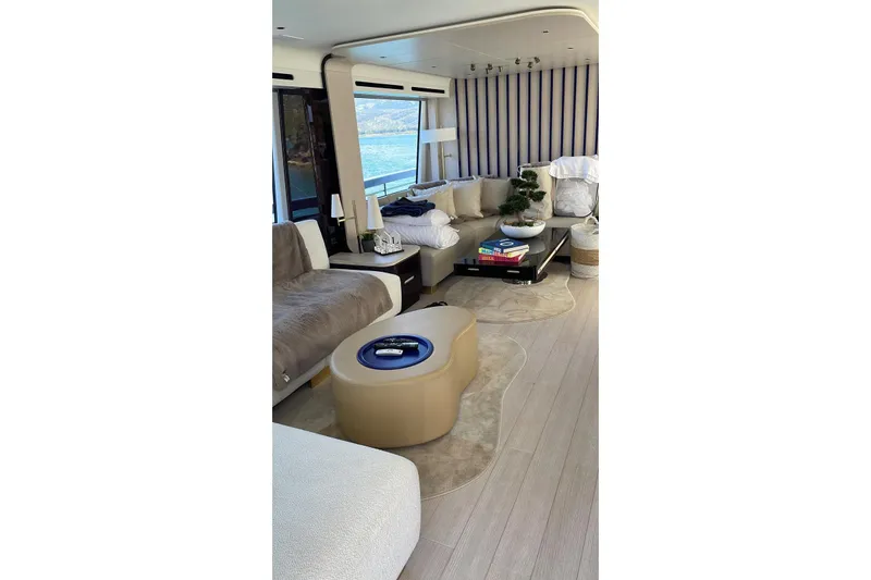 Ma Belle Yacht Photos Pics Luxurious interior of 2022 Azimut Fly 78 yacht with modern furnishings and scenic view.