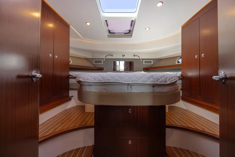  Yacht Photos Pics Luxurious interior of 2026 Nimbus 405 Flybridge yacht with elegant wood finishes.