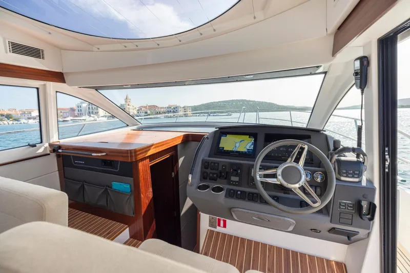  Yacht Photos Pics Interior of 2026 Nimbus 405 Flybridge yacht with modern helm and navigation system.