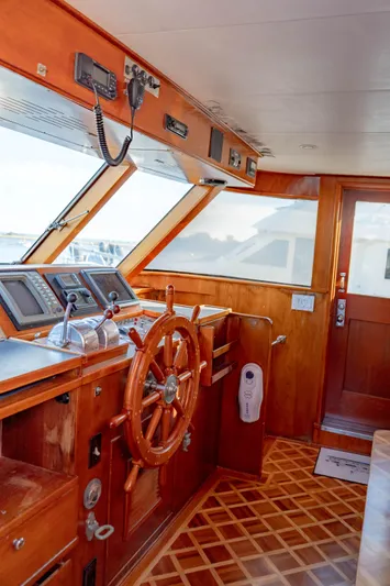 Sea Suite Yacht Photos Pics Vintage 1974 Burger 67 yacht helm with wooden wheel and navigation equipment.