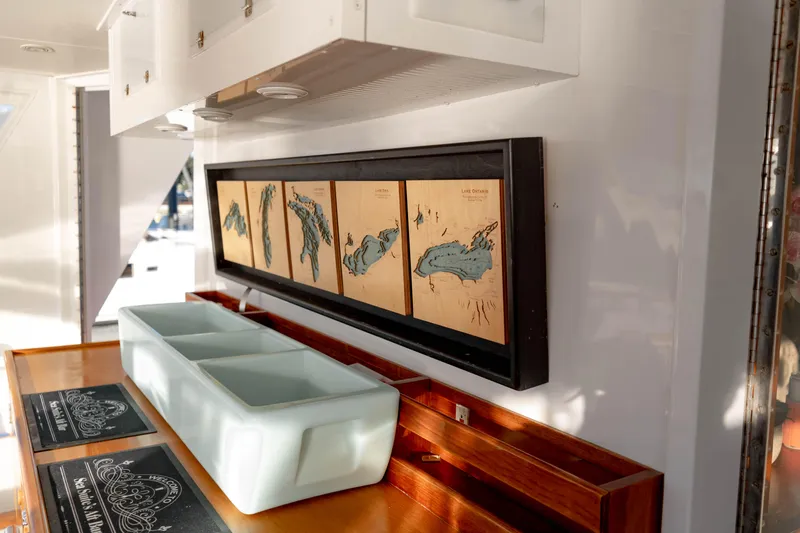 Sea Suite Yacht Photos Pics Interior of a 1974 Burger model 67 yacht with framed nautical maps.