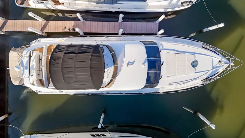  Yacht Photos Pics Aerial view of 1997 Viking Princess 60 Flybridge yacht docked at marina.