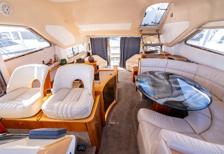  Yacht Photos Pics Luxurious 1997 Viking Princess 60 Flybridge interior with plush seating and elegant design.