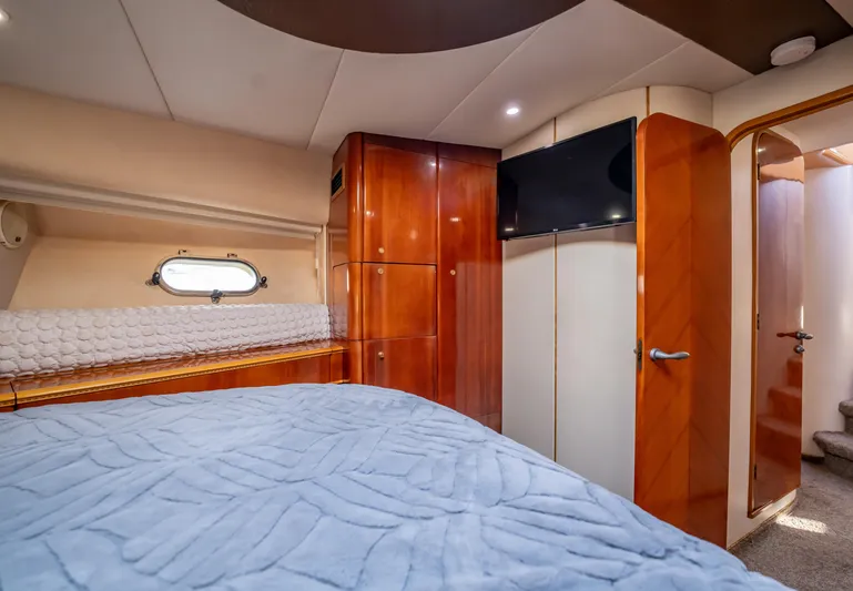  Yacht Photos Pics Luxurious cabin interior of 1997 Viking Princess 60 Flybridge yacht with wood finishes.