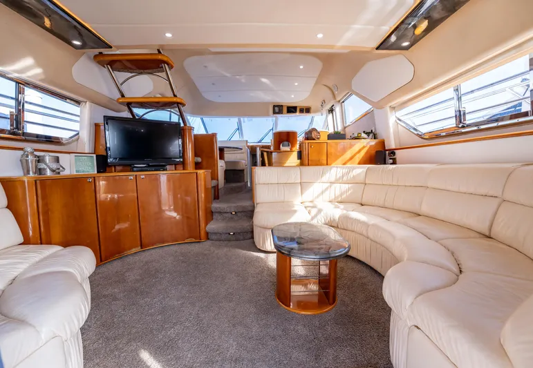  Yacht Photos Pics Luxurious interior of 1997 Viking Princess 60 Flybridge yacht with plush seating and modern amenities.
