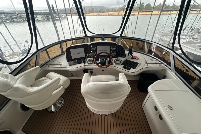 Just One More Yacht Photos Pics 2005 Sea Ray 420 Sedan Bridge helm with Garmin navigation, luxurious seating, and panoramic views.