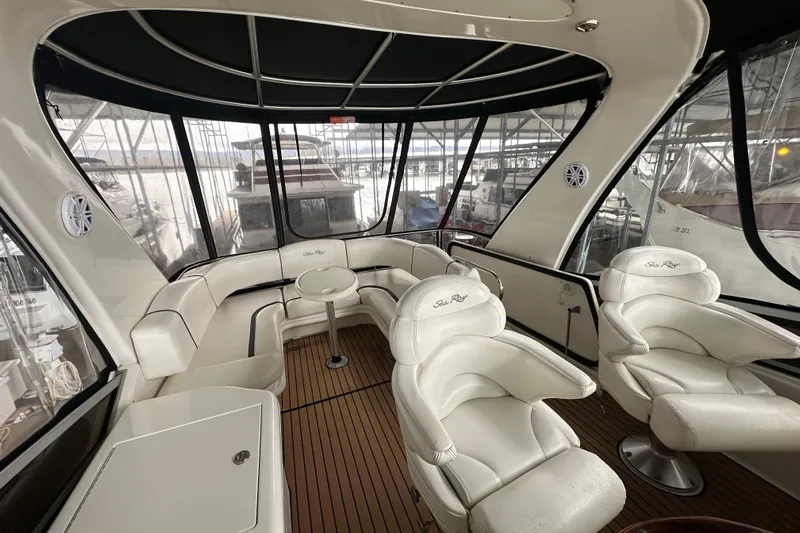 Just One More Yacht Photos Pics Luxurious interior of 2005 Sea Ray 420 Sedan Bridge with plush seating and panoramic windows.
