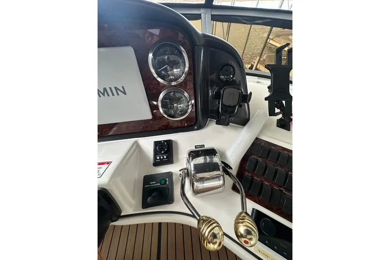 Just One More Yacht Photos Pics Control panel of a 2005 Sea Ray 420 Sedan Bridge with gauges and throttle levers.