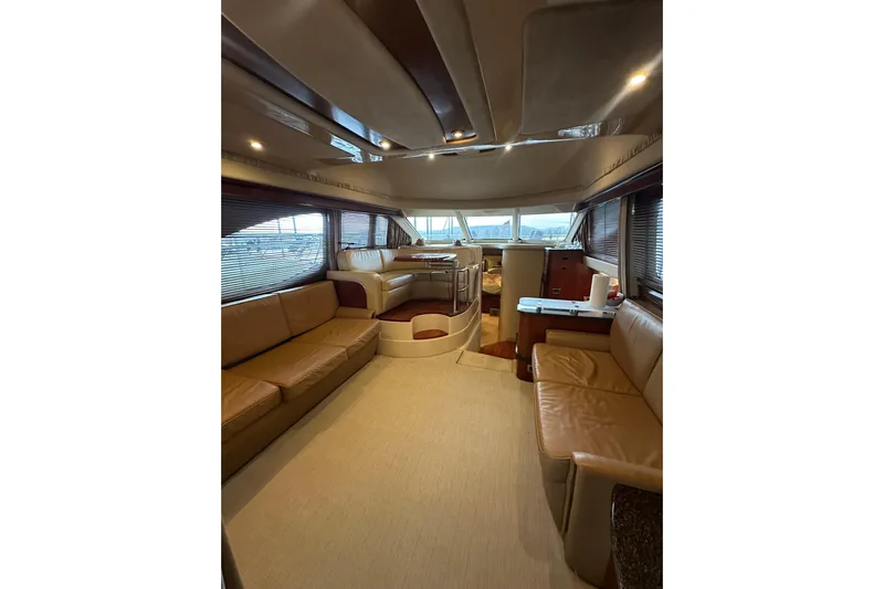 Just One More Yacht Photos Pics Luxurious interior of 2005 Sea Ray 420 Sedan Bridge yacht with leather seating and panoramic windows.