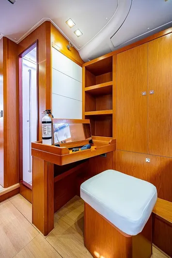 Icon Yacht Photos Pics Interior of 2014 Beneteau Sense 55 yacht with wooden cabinetry and seating.