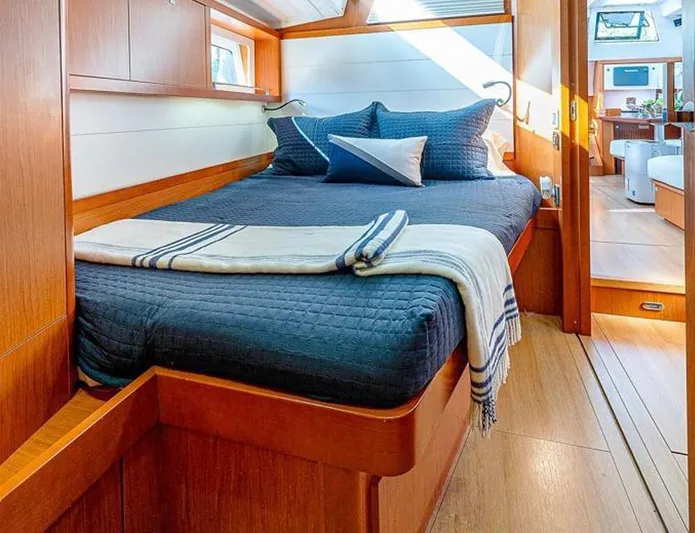 Icon Yacht Photos Pics Luxurious cabin interior of 2014 Beneteau Sense 55 yacht with cozy bedding.
