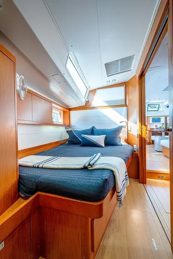 Icon Yacht Photos Pics Luxurious cabin interior of 2014 Beneteau Sense 55 yacht with cozy bedding.