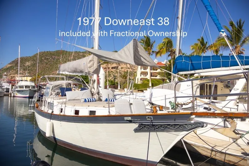 Icon Yacht Photos Pics Sailboat docked in marina, labeled "1977 Downeast 38" with fractional ownership option.