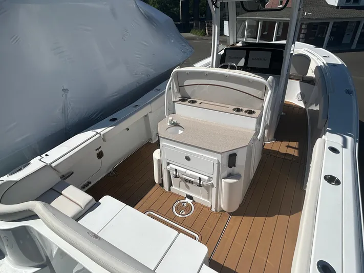  Yacht Photos Pics 2022 Sea Hunt Ultra 275 SE boat interior with seating and storage on deck.