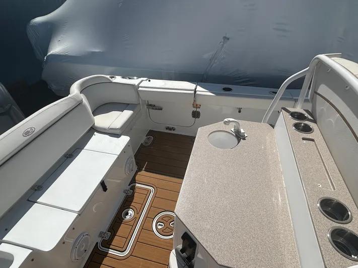  Yacht Photos Pics 2022 Sea Hunt Ultra 275 SE boat interior with seating and deck view.
