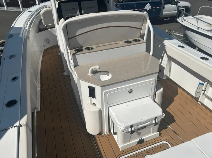  Yacht Photos Pics 2022 Sea Hunt Ultra 275 SE boat interior with seating and storage features.