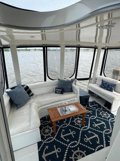 Y Knot Yacht Photos Pics 1997 Carver 405 Aft Cabin interior with nautical decor and waterfront view.