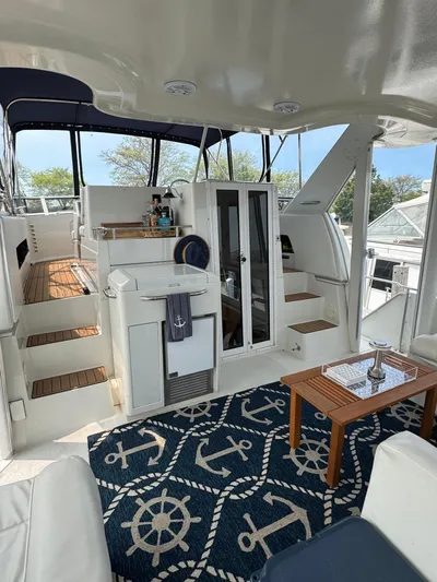 Y Knot Yacht Photos Pics 1997 Carver 405 Aft Cabin interior with nautical decor and modern amenities.