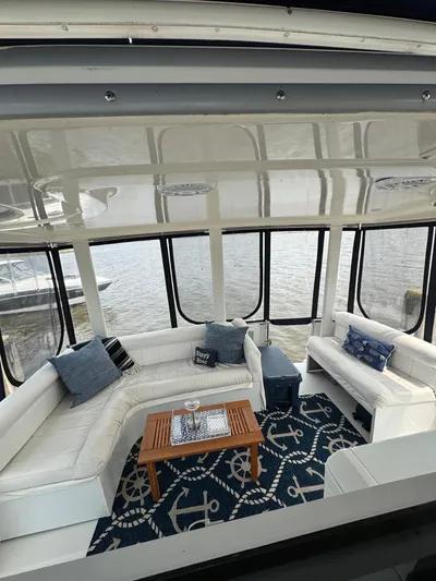 Y Knot Yacht Photos Pics Luxurious interior of 1997 Carver 405 Aft Cabin yacht with nautical-themed decor.