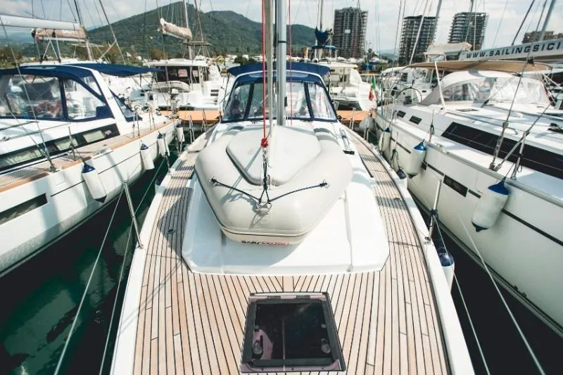  Yacht Photos Pics 2019 Beneteau Oceanis 41.1 yacht docked in marina, surrounded by other boats.