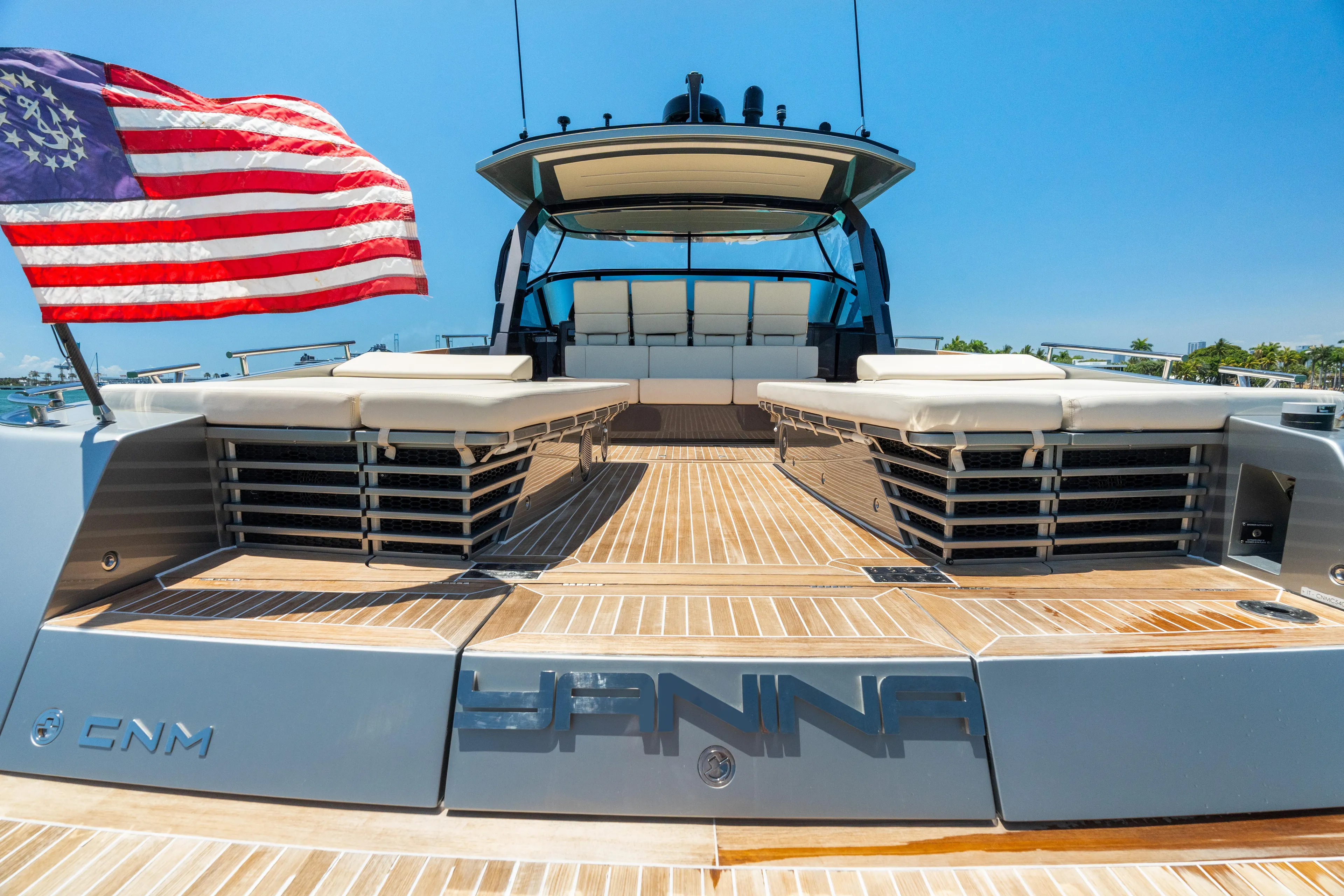 Yanina Yacht Photos Pics Luxury CNM Continental 54T yacht deck with American flag, 2019 model.