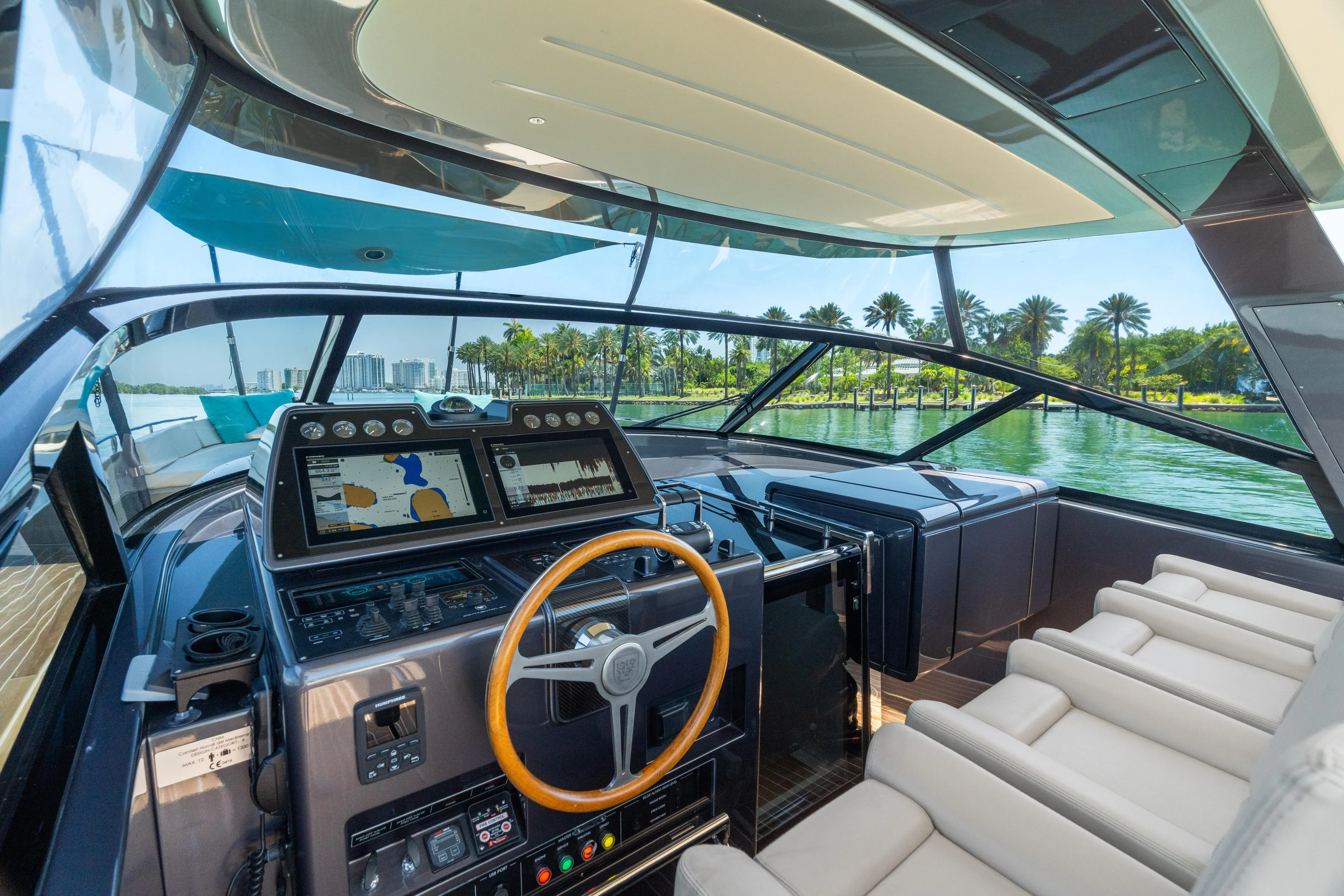 Yanina Yacht Photos Pics Luxurious 2019 CNM Continental 54T yacht cockpit with modern navigation system and plush seating.