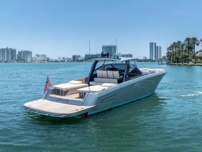 Yanina Yacht Photos Pics 2019 CNM Continental 54T yacht cruising in sunny waterfront cityscape.