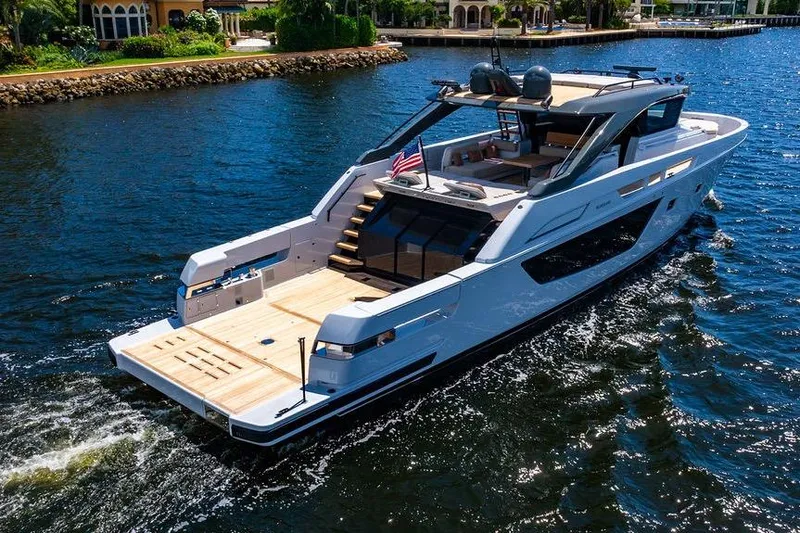 Snack Money Yacht Photos Pics Luxury 2023 Bluegame BG 72 yacht cruising on a sunny day.