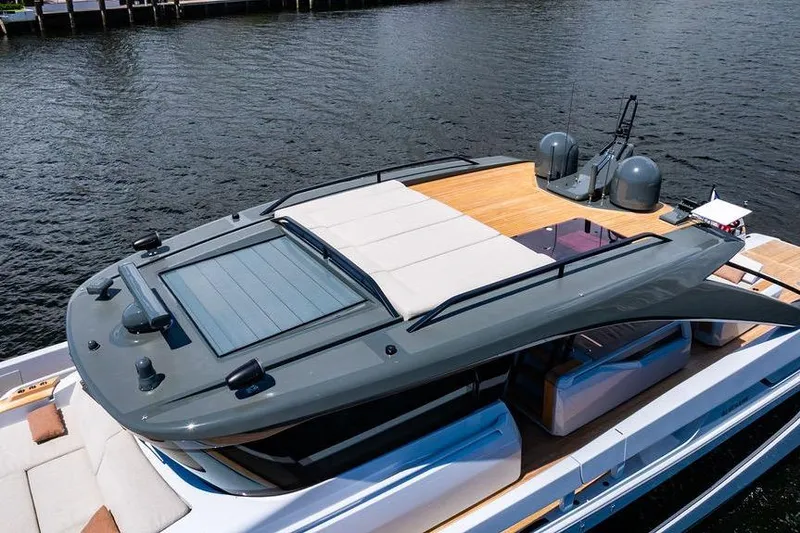 Snack Money Yacht Photos Pics 2023 Bluegame BG 72 yacht with sleek design and spacious deck on water.