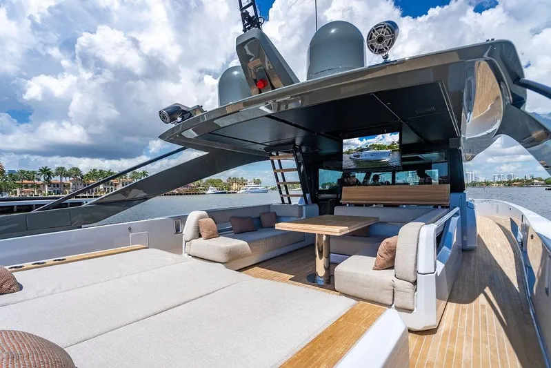Snack Money Yacht Photos Pics Luxurious 2023 Bluegame BG 72 yacht with spacious outdoor seating and elegant design.