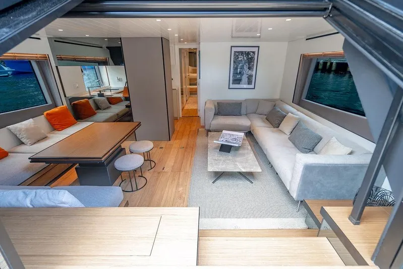 Snack Money Yacht Photos Pics Luxurious interior of 2023 Bluegame BG 72 yacht with modern seating and elegant decor.