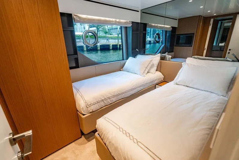 Snack Money Yacht Photos Pics Luxurious cabin interior of 2023 Bluegame BG 72 yacht with twin beds and scenic window view.