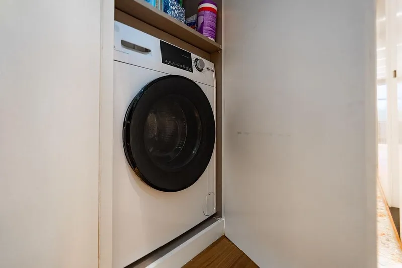 Snack Money Yacht Photos Pics Washing machine in cabinet on Bluegame BG 72 yacht, 2023 model.