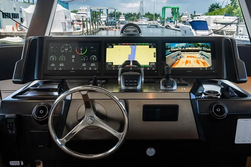 Snack Money Yacht Photos Pics Cockpit of 2023 Bluegame BG 72 yacht with advanced navigation displays and controls.