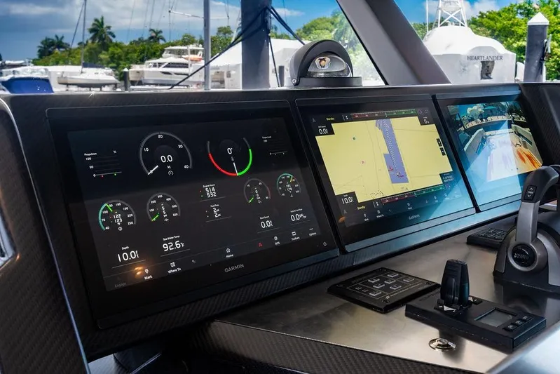 Snack Money Yacht Photos Pics Control panel of 2023 Bluegame BG 72 yacht with navigation and monitoring screens.